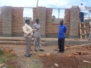 district-officer-inspecting-construction